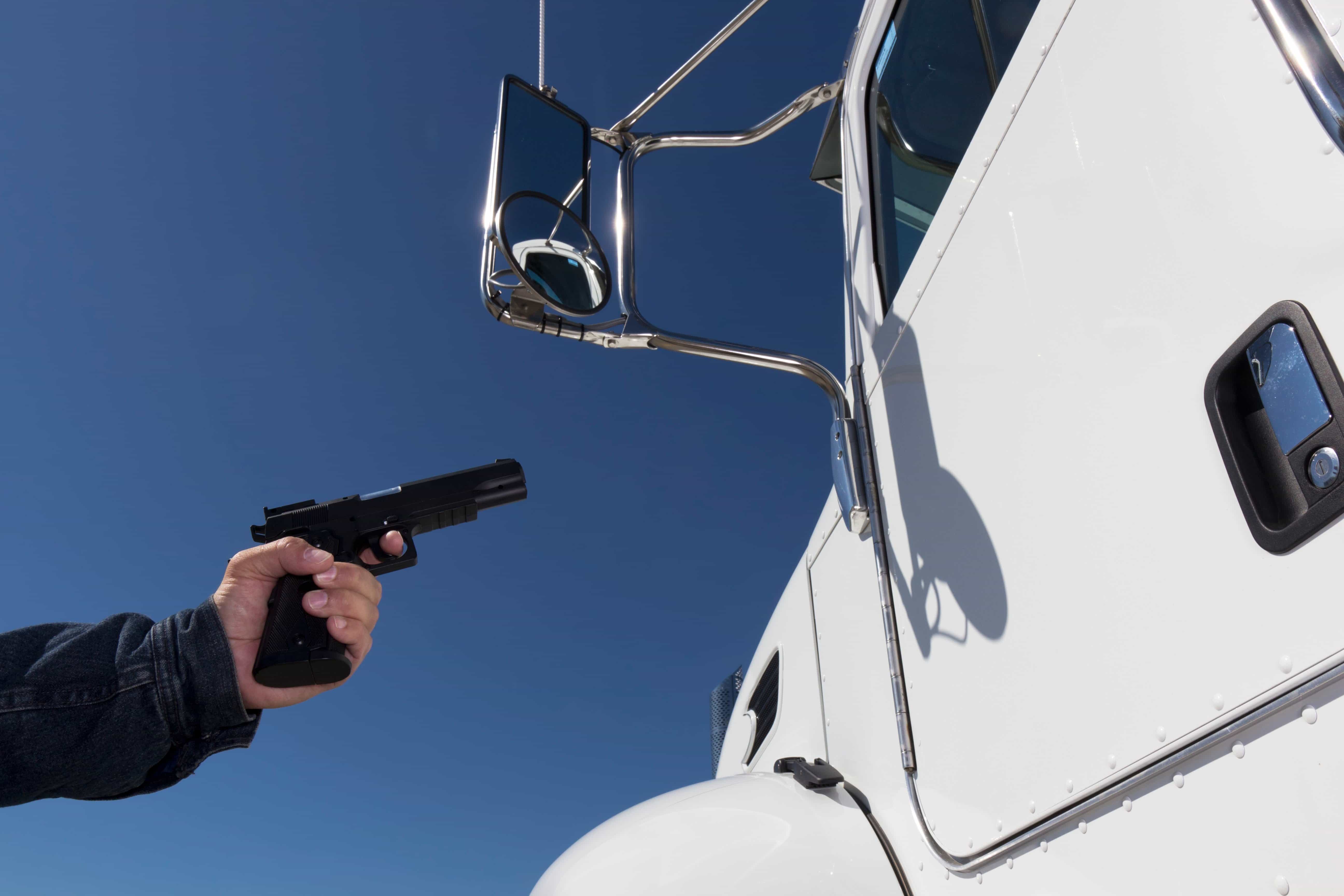 Gun pointed at truck window